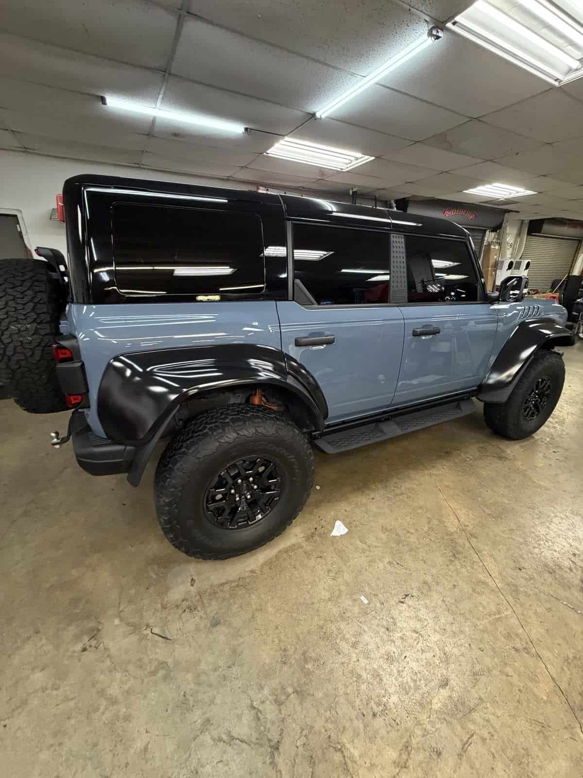blue bronco in bay