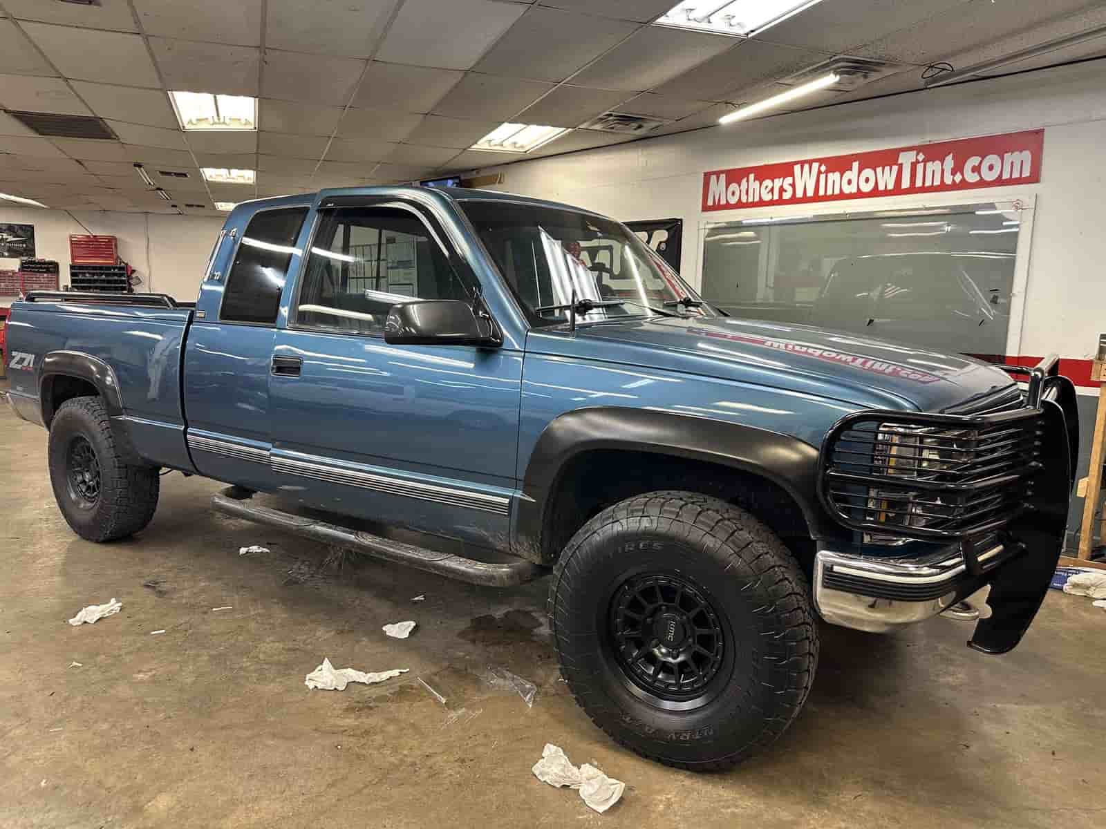 blue truck in bay