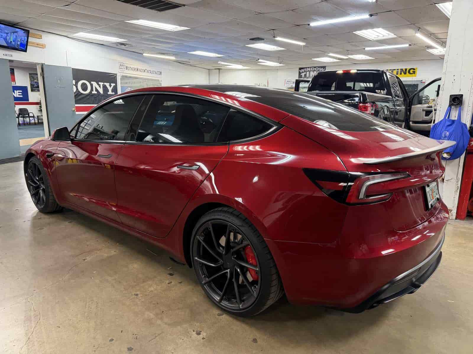 red tesla in bay