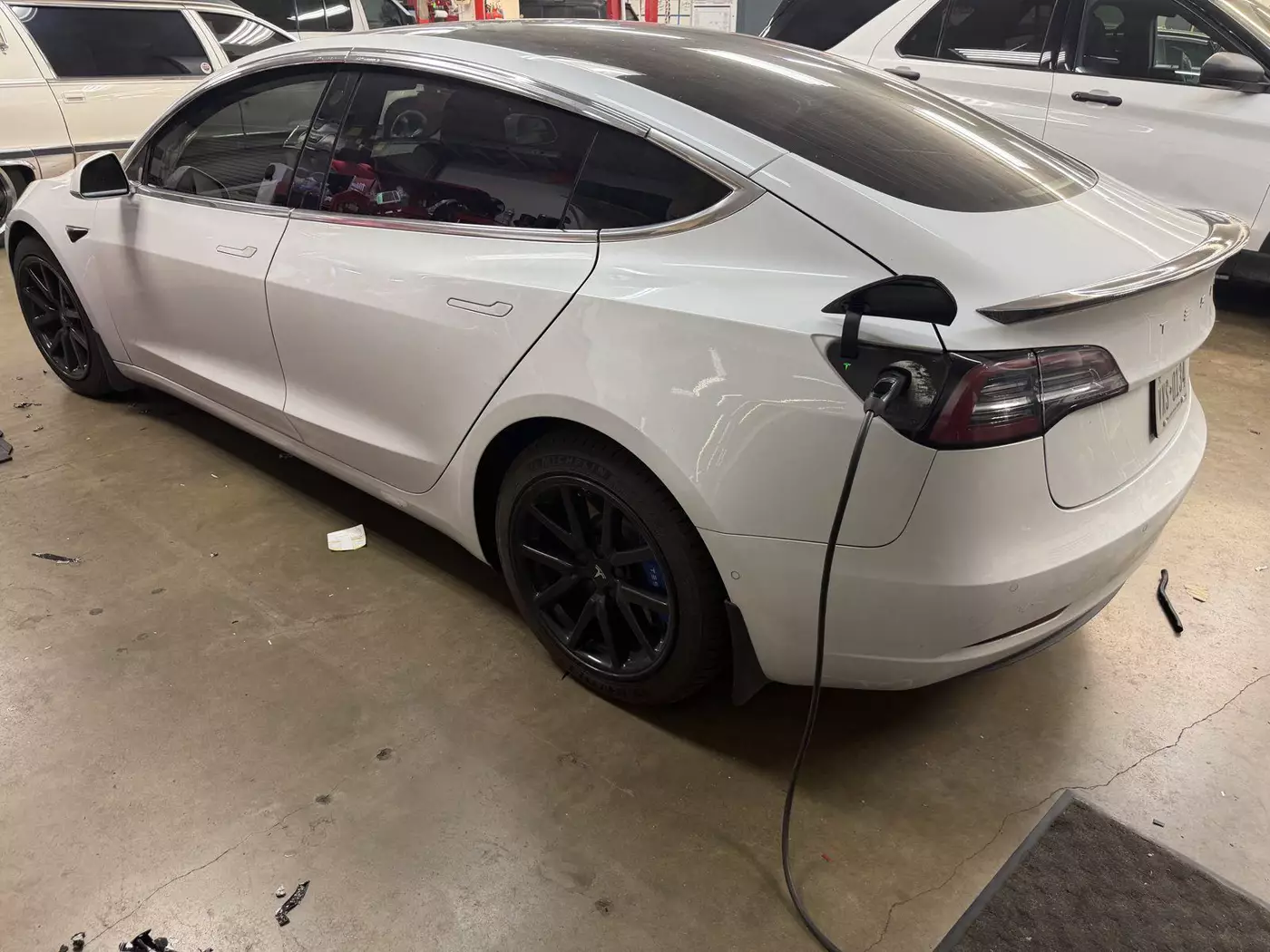 white tesla charging