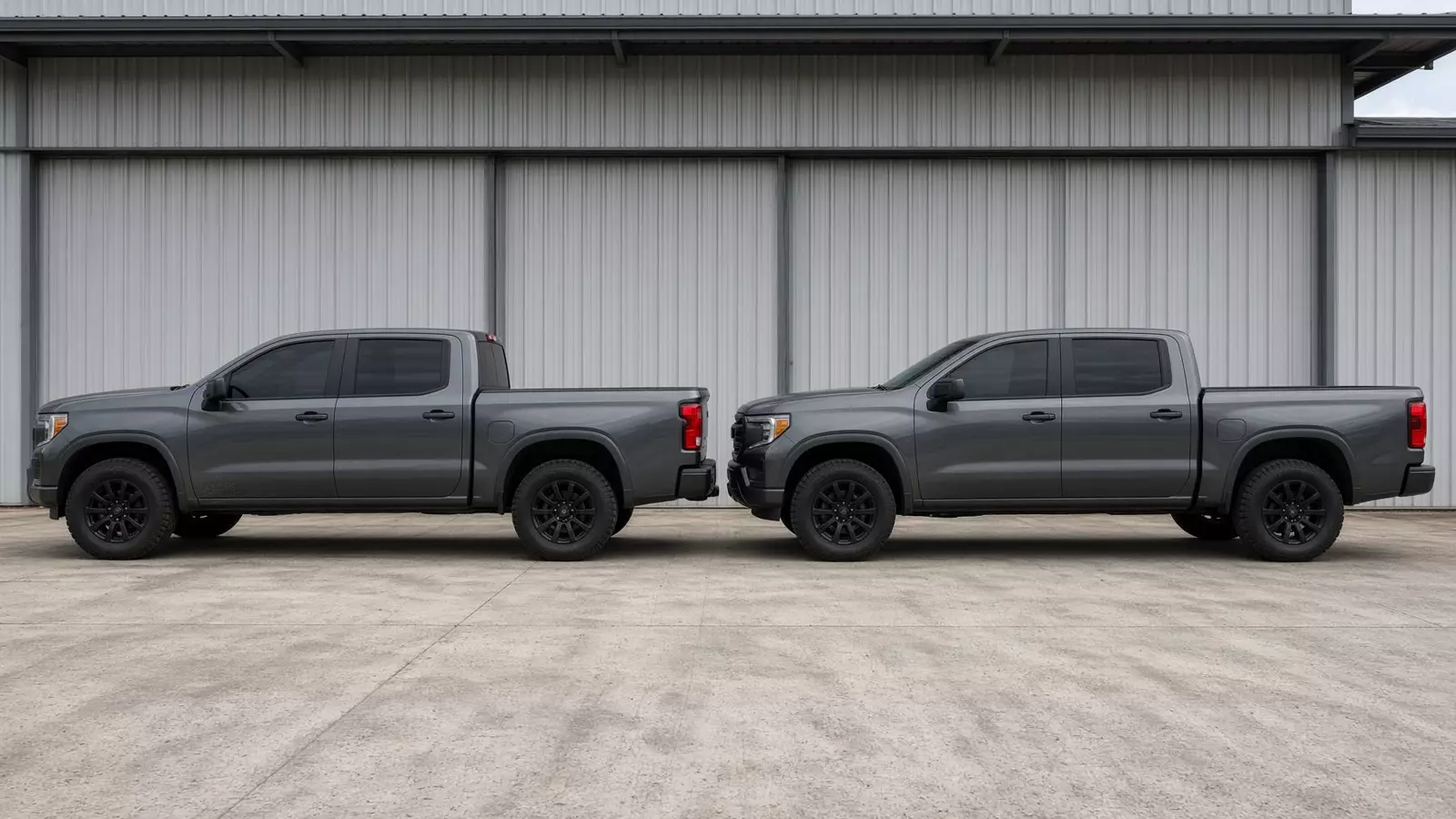 Two work trucks with tinted glass parked at the shop